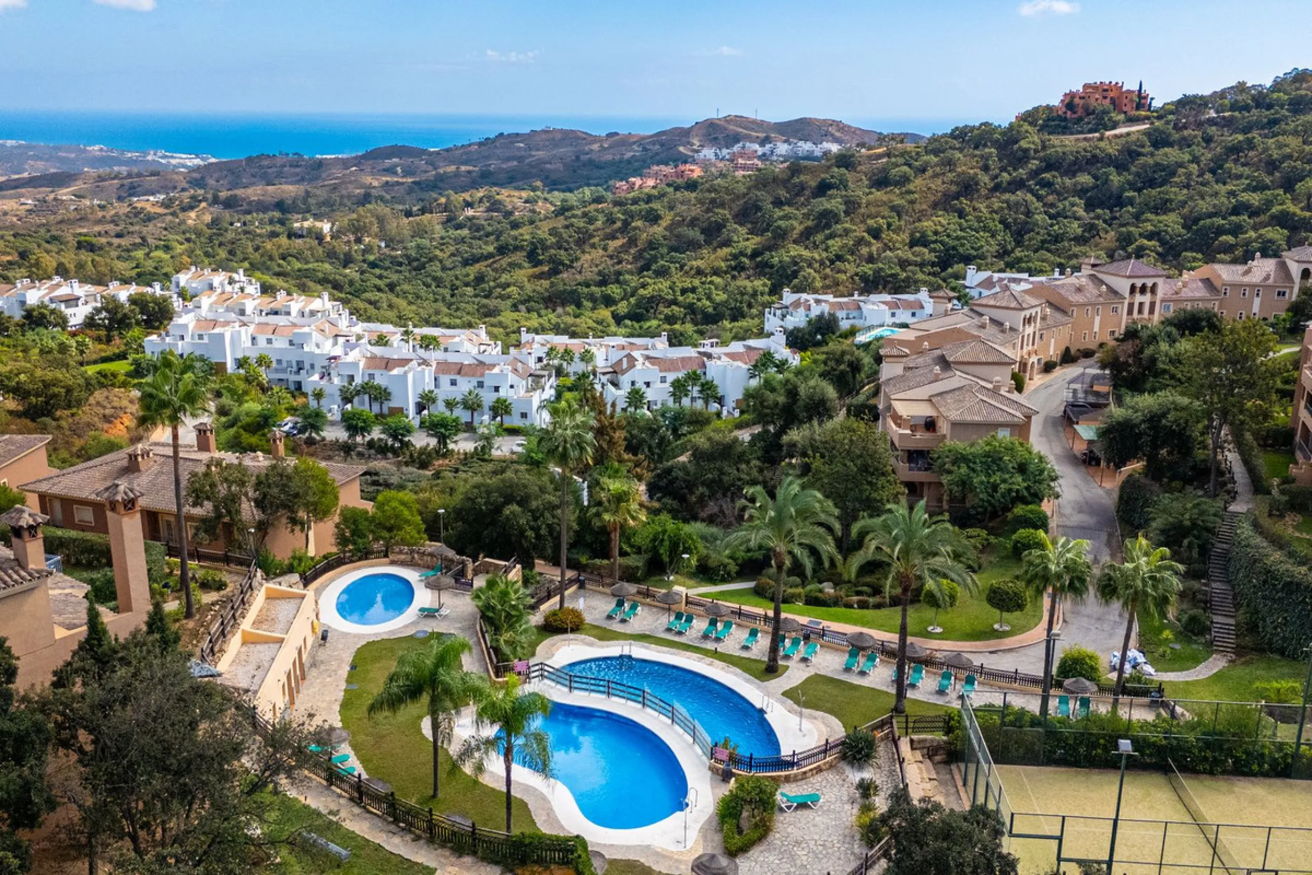 Discover this beautiful 2-bedroom 'penthouse-like feel' middle-floor apartment perfectly positioned in the prestigious enclave of La Mairena / Elviria Alta on Marbella's sought-after east coast. Surrounded by natural beauty, SEA and mountain views, this e