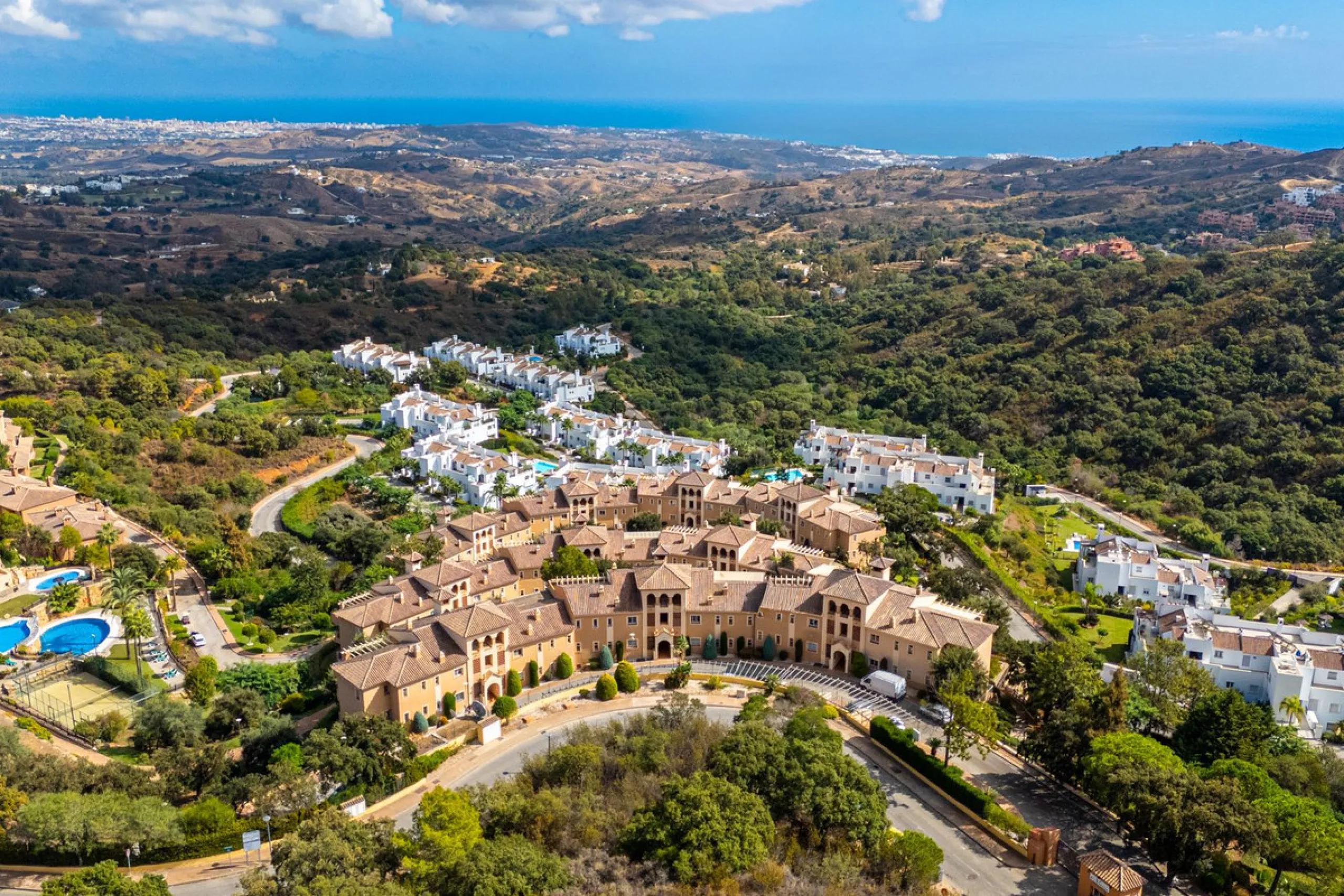 Discover this beautiful 2-bedroom 'penthouse-like feel' middle-floor apartment perfectly positioned in the prestigious enclave of La Mairena / Elviria Alta on Marbella's sought-after east coast. Surrounded by natural beauty, SEA and mountain views, this e