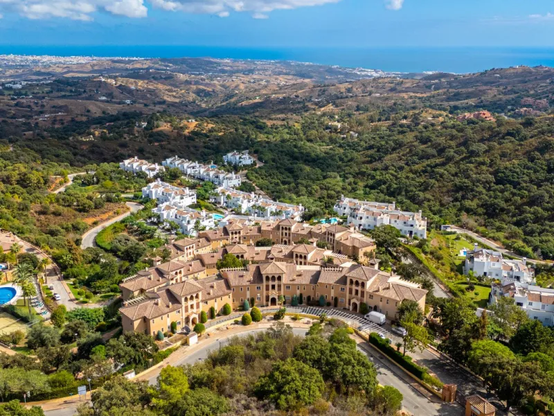 Discover this beautiful 2-bedroom 'penthouse-like feel' middle-floor apartment perfectly positioned in the prestigious enclave of La Mairena / Elviria Alta on Marbella's sought-after east coast. Surrounded by natural beauty, SEA and mountain views, this e