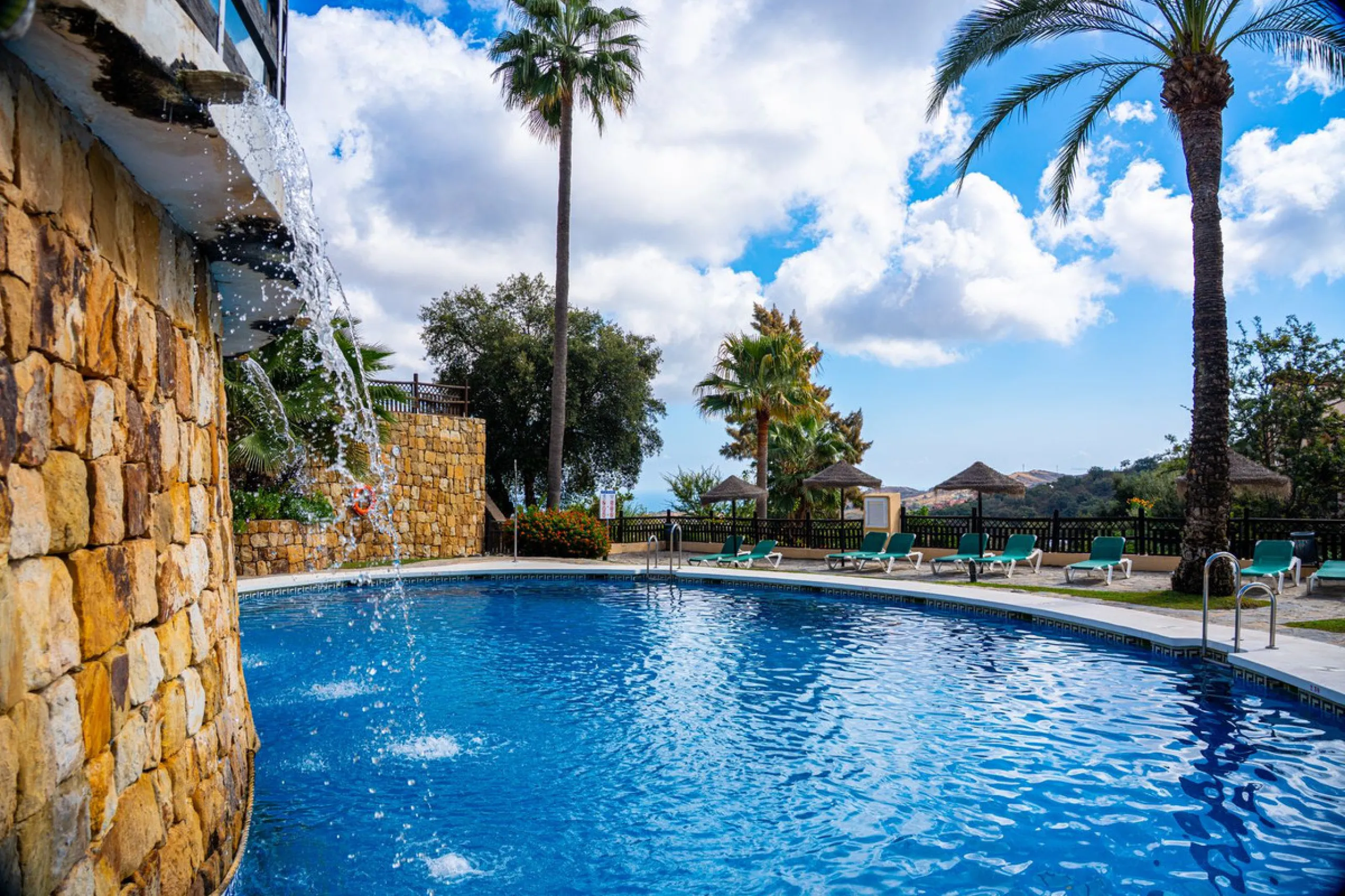 Discover this beautiful 2-bedroom 'penthouse-like feel' middle-floor apartment perfectly positioned in the prestigious enclave of La Mairena / Elviria Alta on Marbella's sought-after east coast. Surrounded by natural beauty, SEA and mountain views, this e
