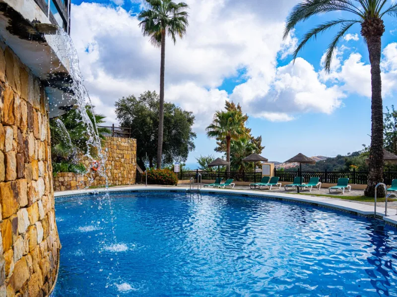 Discover this beautiful 2-bedroom 'penthouse-like feel' middle-floor apartment perfectly positioned in the prestigious enclave of La Mairena / Elviria Alta on Marbella's sought-after east coast. Surrounded by natural beauty, SEA and mountain views, this e