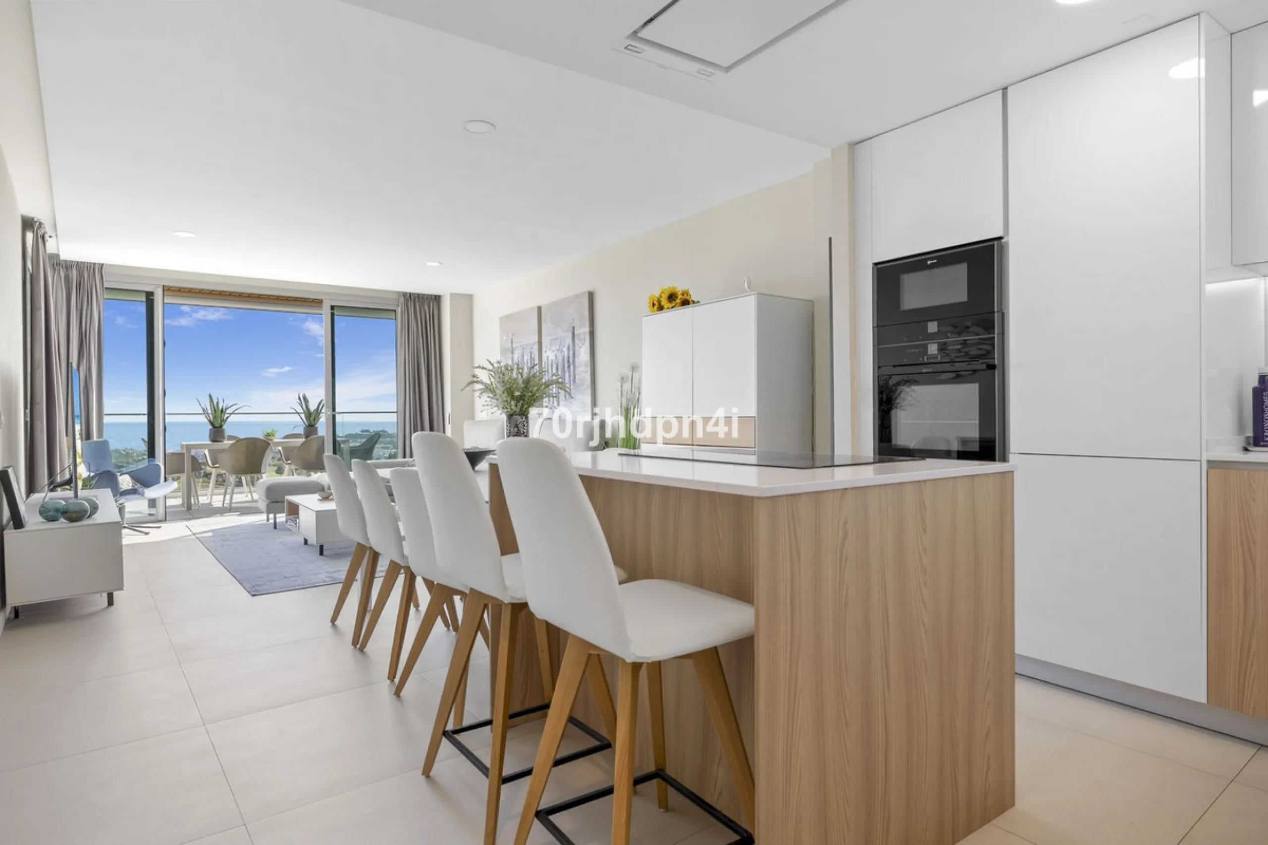 Modern first-floor apartment in ONE Residences, Calanova Golf, offering panoramic sea and golf views. South-facing with a spacious 40 m² terrace.