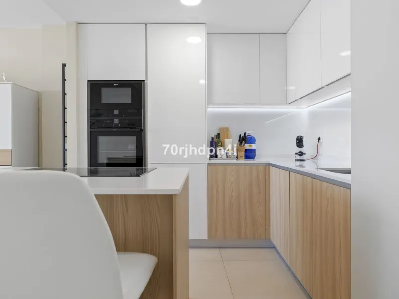 Modern first-floor apartment in ONE Residences, Calanova Golf, offering panoramic sea and golf views. South-facing with a spacious 40 m² terrace.