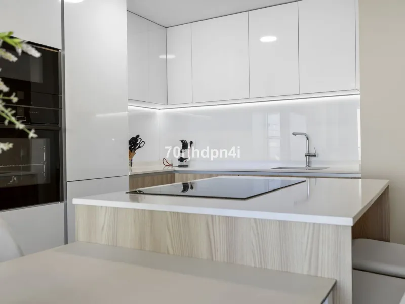 Modern first-floor apartment in ONE Residences, Calanova Golf, offering panoramic sea and golf views. South-facing with a spacious 40 m² terrace.