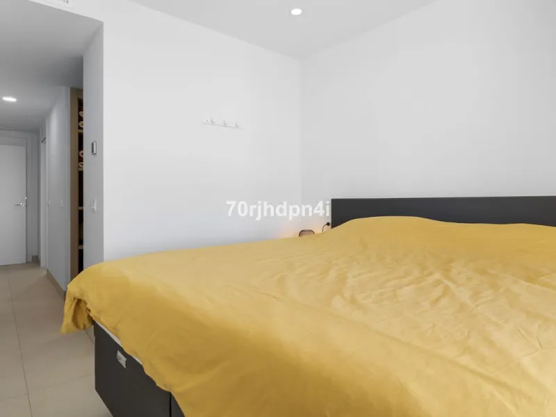 Modern first-floor apartment in ONE Residences, Calanova Golf, offering panoramic sea and golf views. South-facing with a spacious 40 m² terrace.