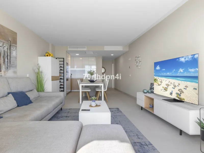Modern first-floor apartment in ONE Residences, Calanova Golf, offering panoramic sea and golf views. South-facing with a spacious 40 m² terrace.
