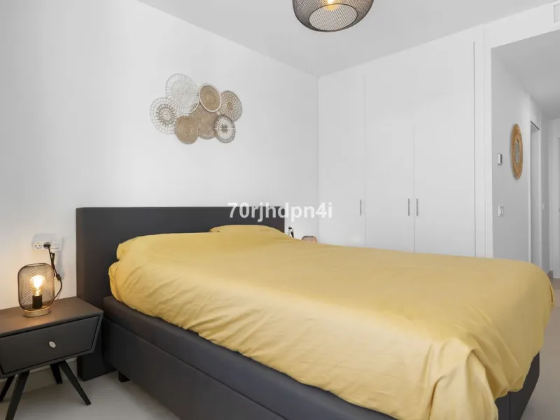 Modern first-floor apartment in ONE Residences, Calanova Golf, offering panoramic sea and golf views. South-facing with a spacious 40 m² terrace.