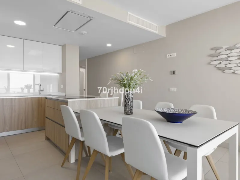 Modern first-floor apartment in ONE Residences, Calanova Golf, offering panoramic sea and golf views. South-facing with a spacious 40 m² terrace.