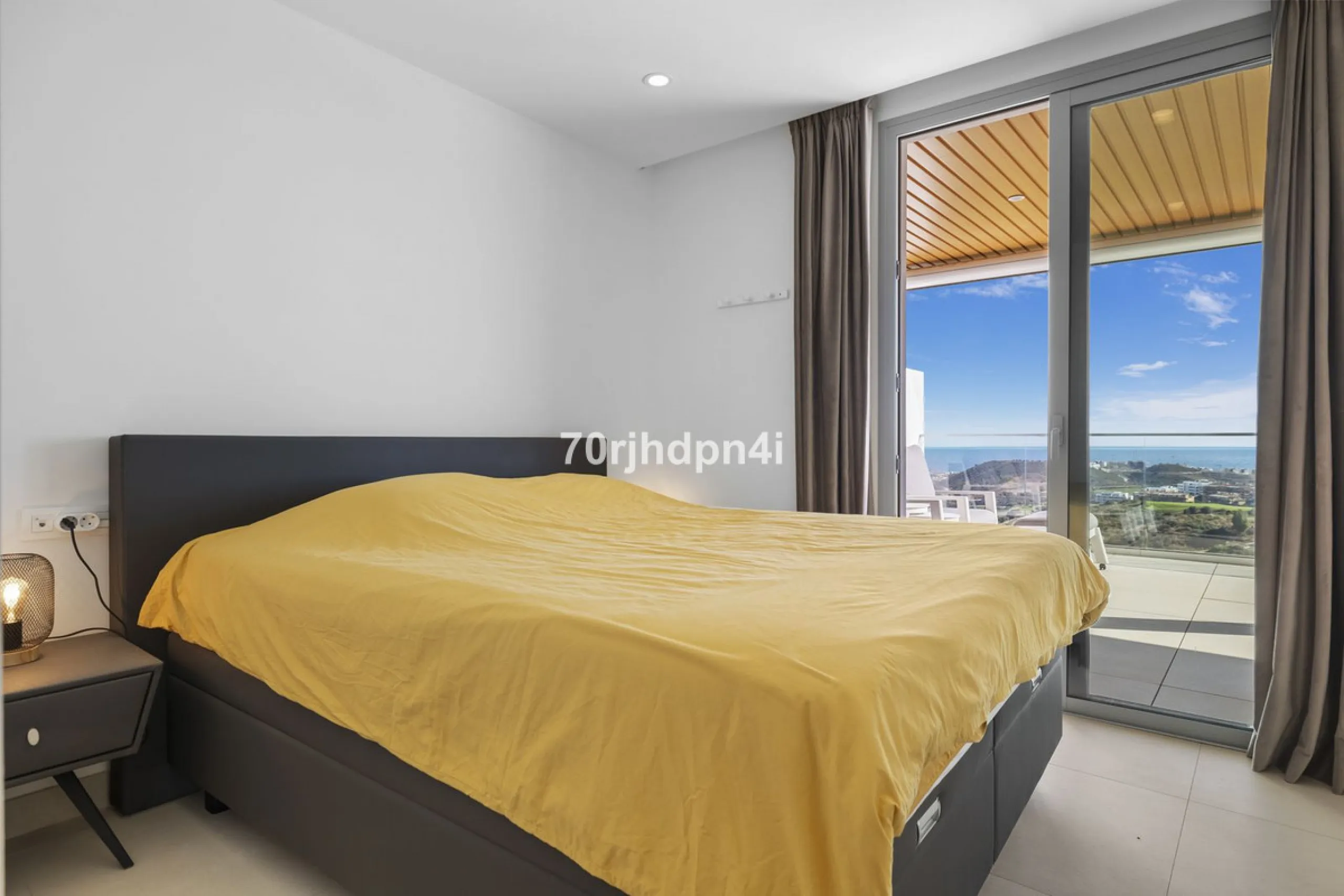 Modern first-floor apartment in ONE Residences, Calanova Golf, offering panoramic sea and golf views. South-facing with a spacious 40 m² terrace.