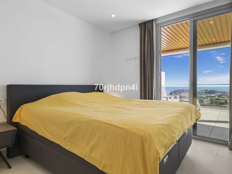 Modern first-floor apartment in ONE Residences, Calanova Golf, offering panoramic sea and golf views. South-facing with a spacious 40 m² terrace.