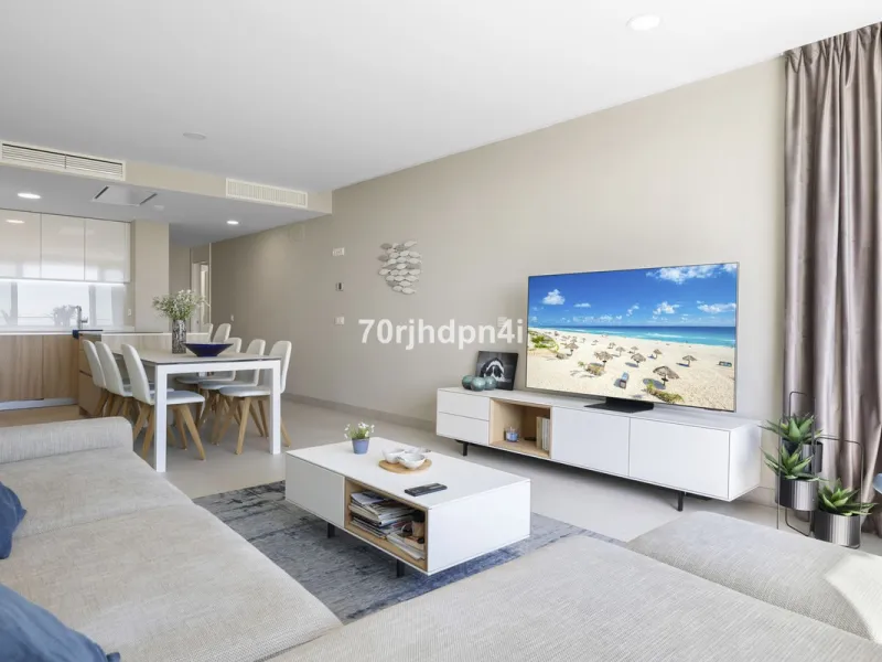 Modern first-floor apartment in ONE Residences, Calanova Golf, offering panoramic sea and golf views. South-facing with a spacious 40 m² terrace.