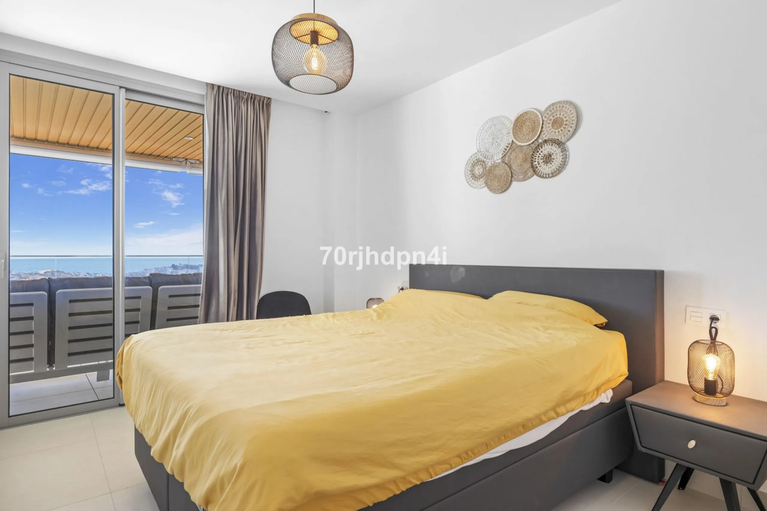 Modern first-floor apartment in ONE Residences, Calanova Golf, offering panoramic sea and golf views. South-facing with a spacious 40 m² terrace.