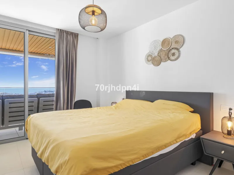 Modern first-floor apartment in ONE Residences, Calanova Golf, offering panoramic sea and golf views. South-facing with a spacious 40 m² terrace.