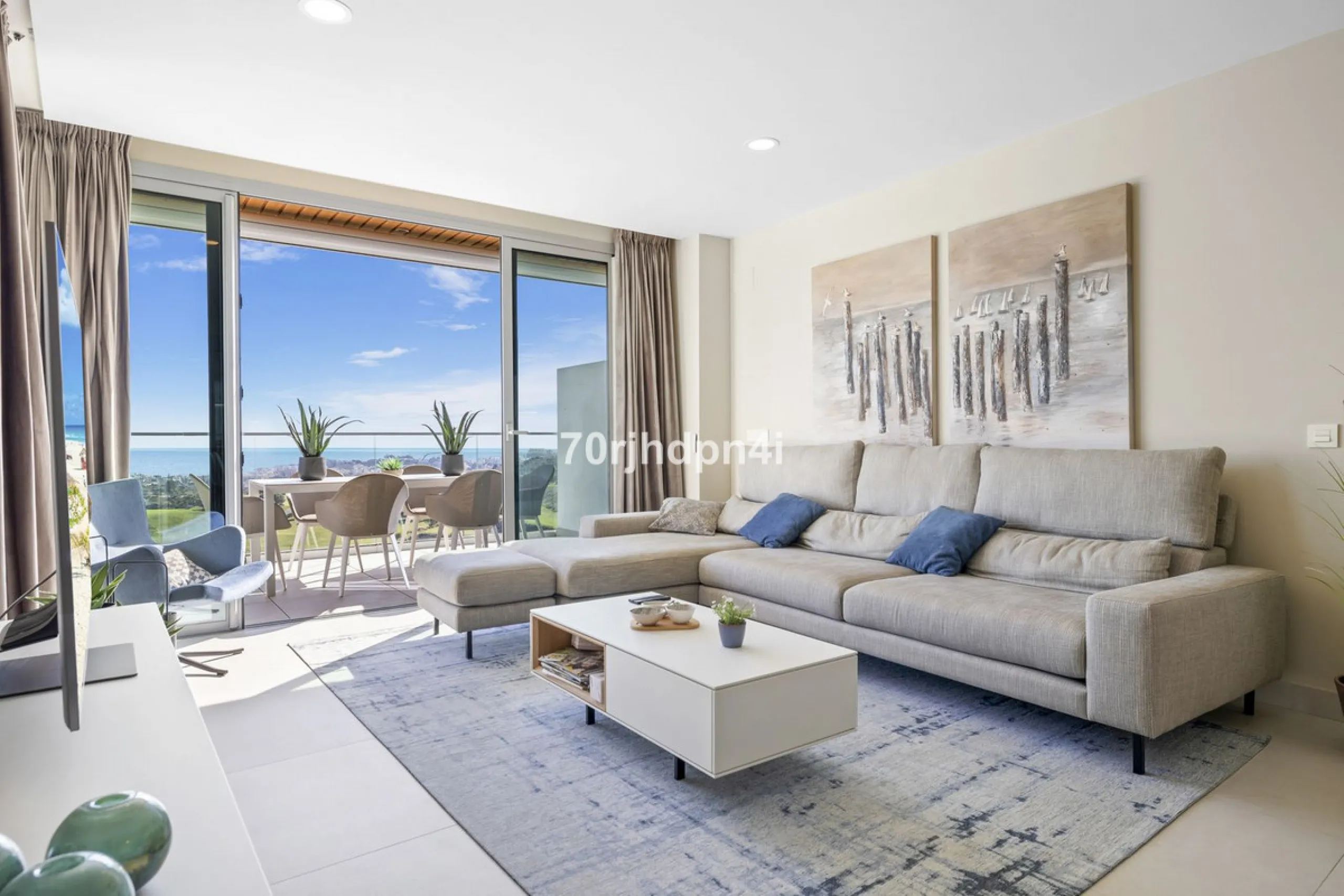 Modern first-floor apartment in ONE Residences, Calanova Golf, offering panoramic sea and golf views. South-facing with a spacious 40 m² terrace.