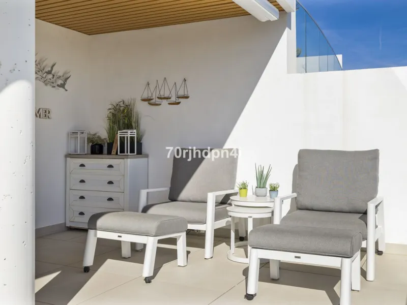 Modern first-floor apartment in ONE Residences, Calanova Golf, offering panoramic sea and golf views. South-facing with a spacious 40 m² terrace.