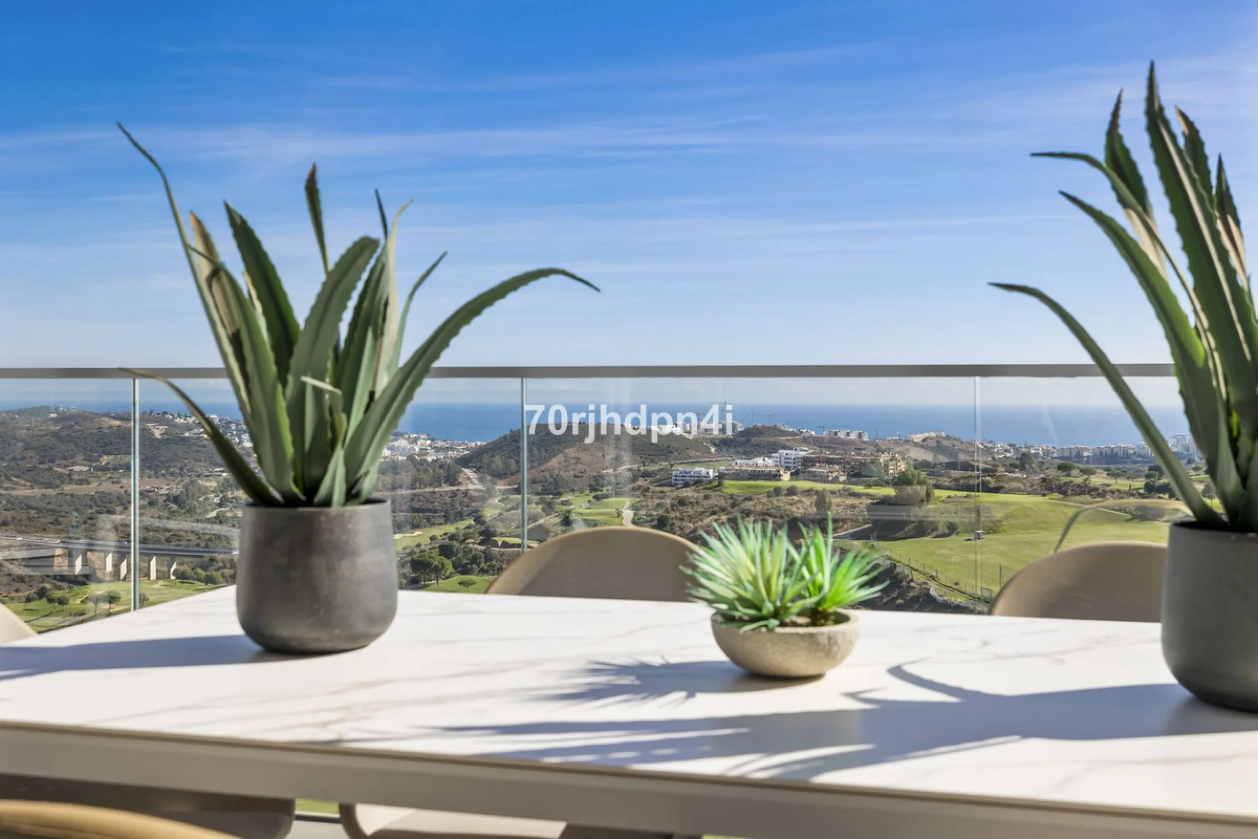 Modern first-floor apartment in ONE Residences, Calanova Golf, offering panoramic sea and golf views. South-facing with a spacious 40 m² terrace.