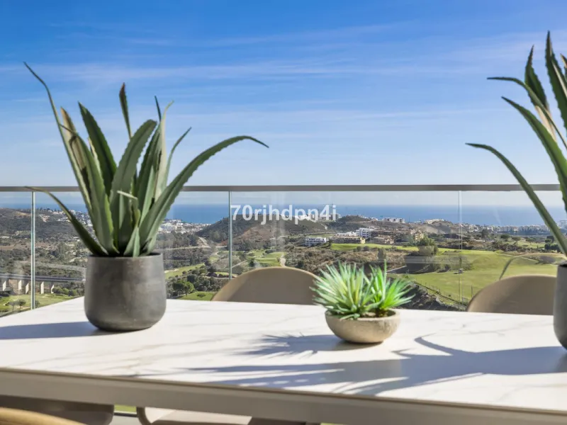 Modern first-floor apartment in ONE Residences, Calanova Golf, offering panoramic sea and golf views. South-facing with a spacious 40 m² terrace.