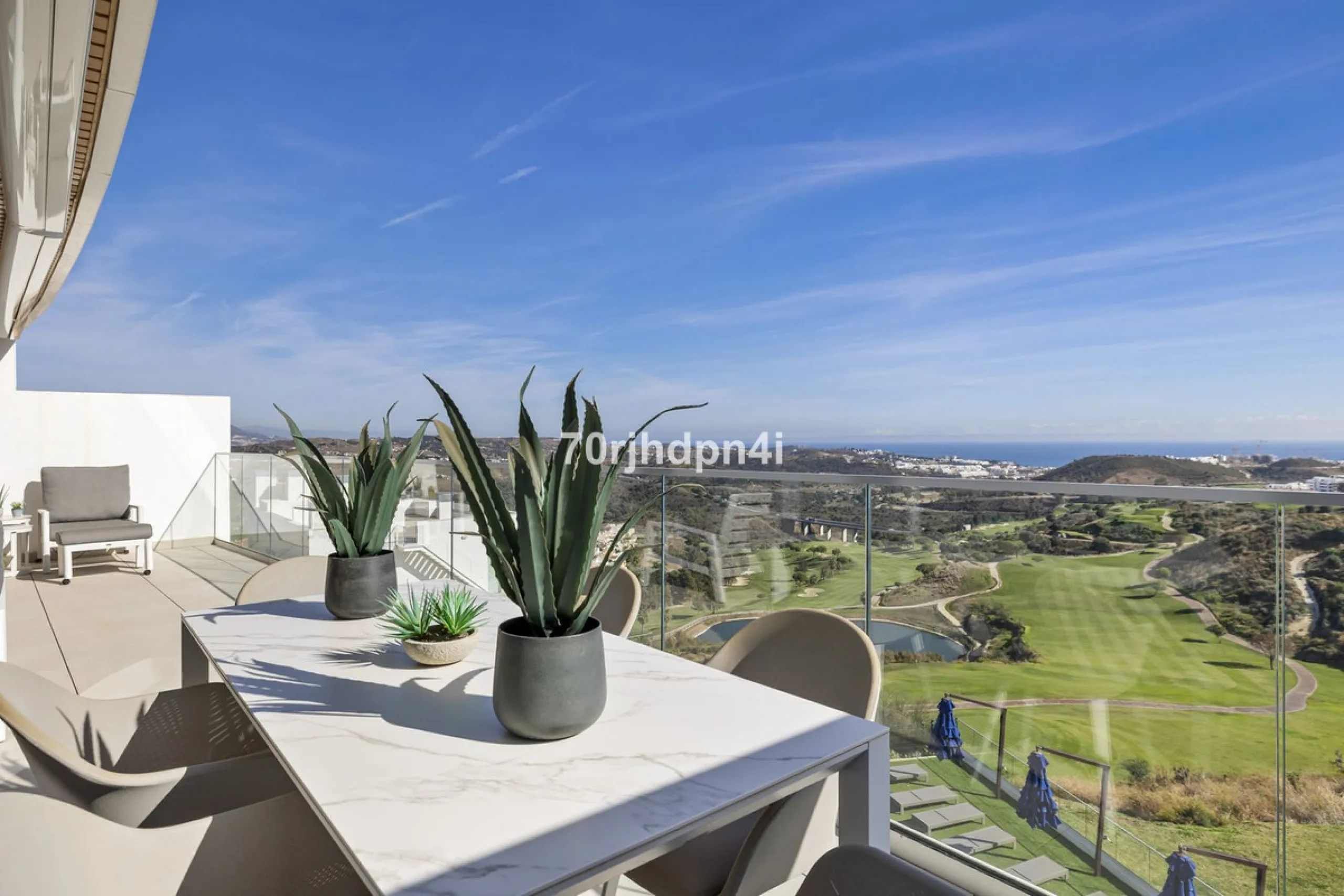 Modern first-floor apartment in ONE Residences, Calanova Golf, offering panoramic sea and golf views. South-facing with a spacious 40 m² terrace.