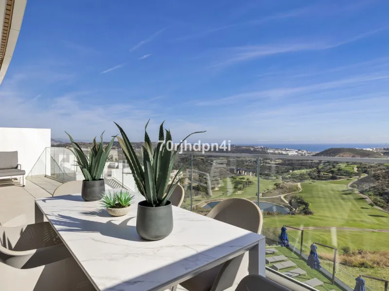 Modern first-floor apartment in ONE Residences, Calanova Golf, offering panoramic sea and golf views. South-facing with a spacious 40 m² terrace.