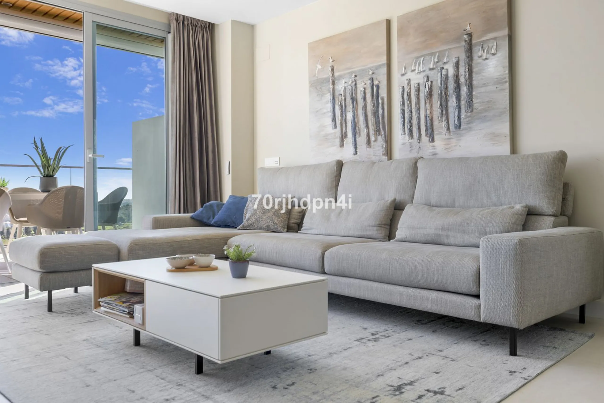 Modern first-floor apartment in ONE Residences, Calanova Golf, offering panoramic sea and golf views. South-facing with a spacious 40 m² terrace.