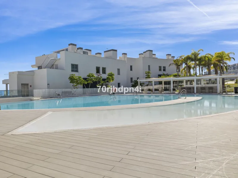 Modern first-floor apartment in ONE Residences, Calanova Golf, offering panoramic sea and golf views. South-facing with a spacious 40 m² terrace.