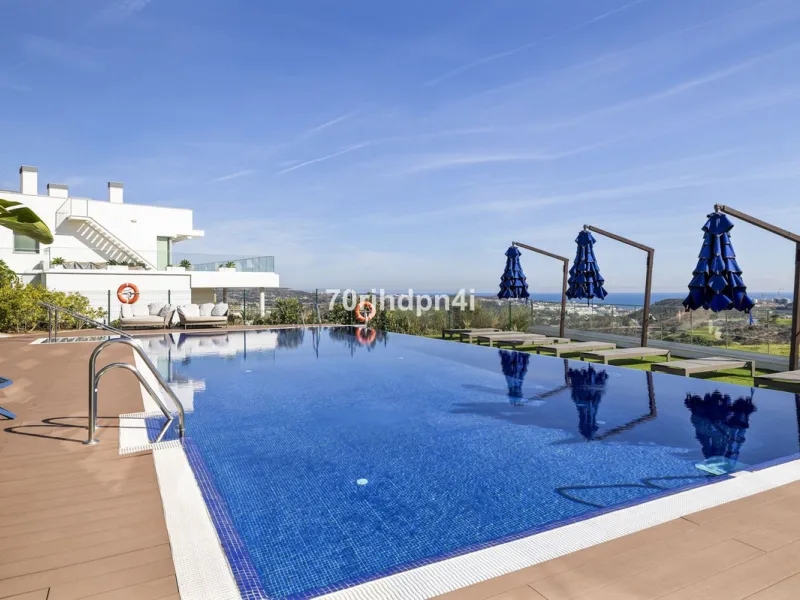 Modern first-floor apartment in ONE Residences, Calanova Golf, offering panoramic sea and golf views. South-facing with a spacious 40 m² terrace.