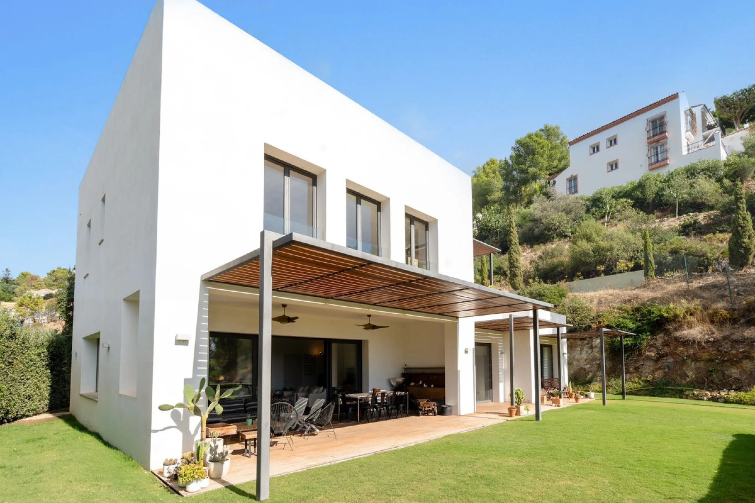 Modern Mediterranean villa in El Madroñal, a contemporary hillside retreat with breathtaking mountain and sea views.