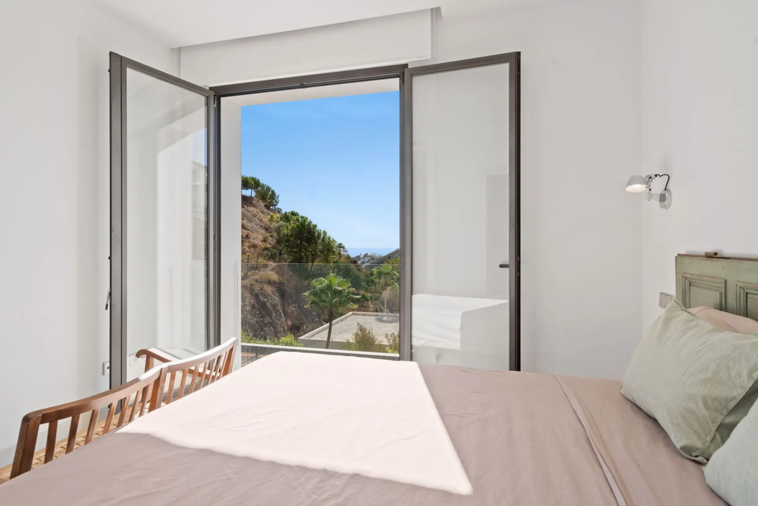 Modern Mediterranean villa in El Madroñal, a contemporary hillside retreat with breathtaking mountain and sea views.
