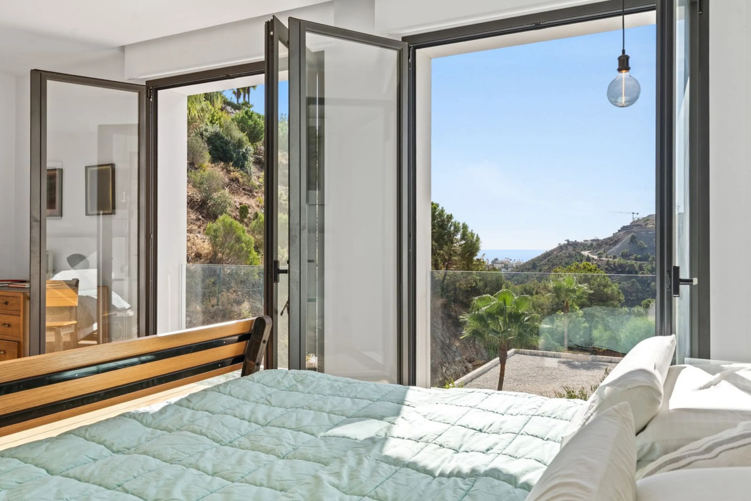 Modern Mediterranean villa in El Madroñal, a contemporary hillside retreat with breathtaking mountain and sea views.