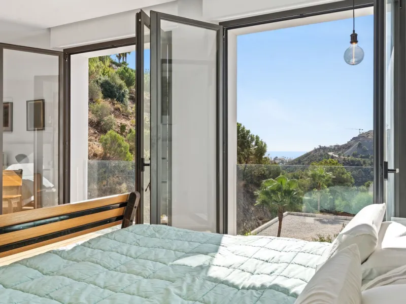 Modern Mediterranean villa in El Madroñal, a contemporary hillside retreat with breathtaking mountain and sea views.