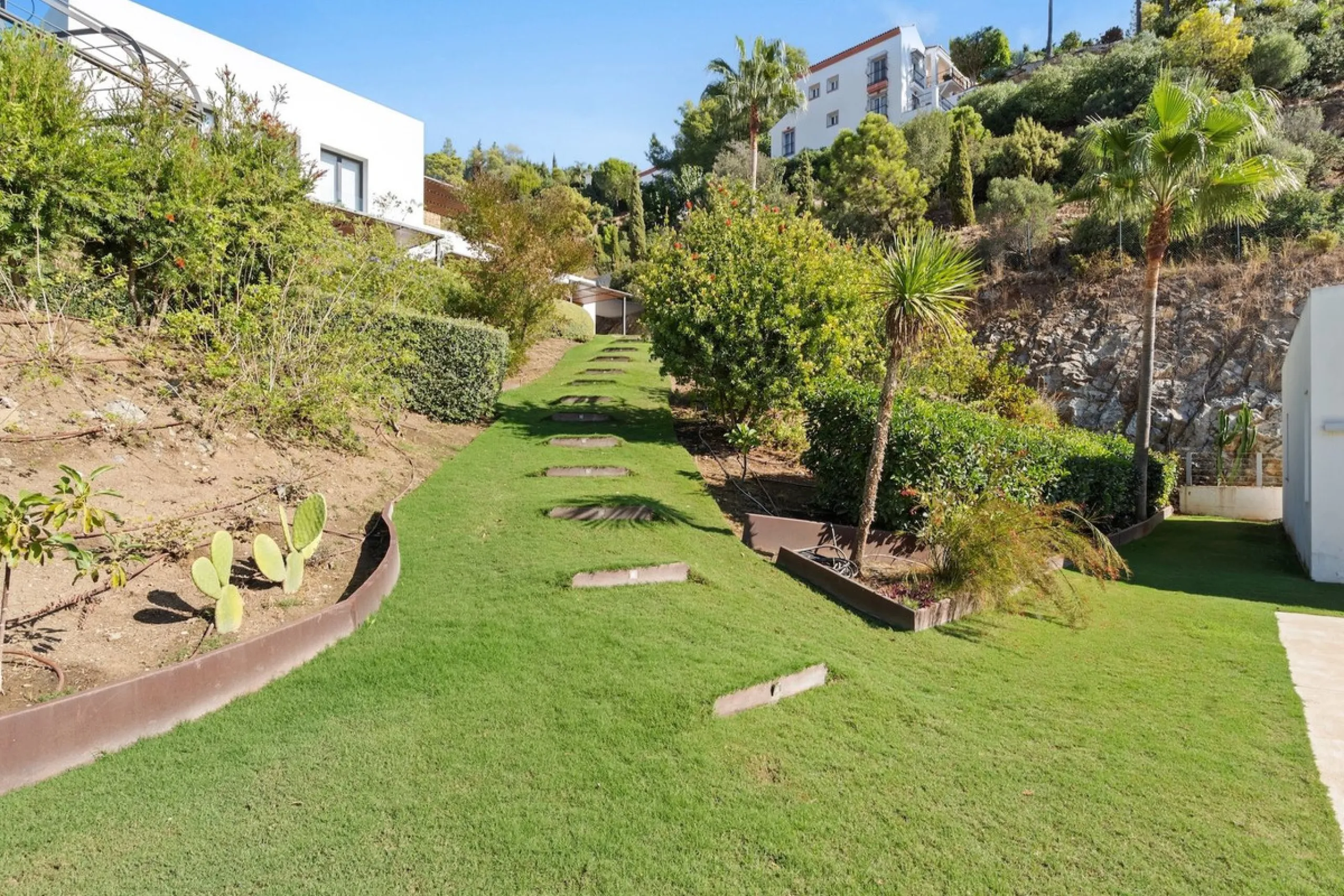 Modern Mediterranean villa in El Madroñal, a contemporary hillside retreat with breathtaking mountain and sea views.