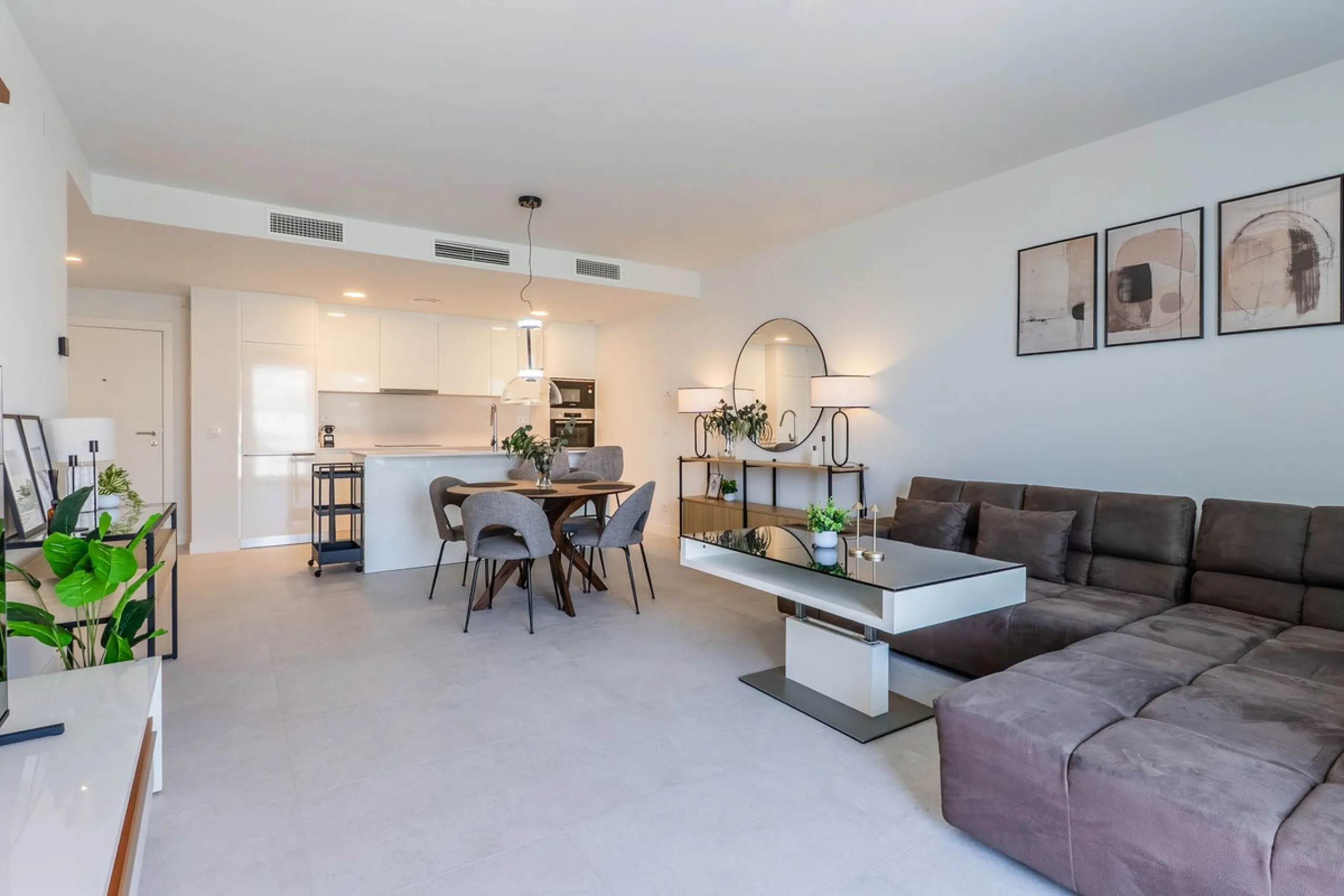 This stylish 93m² apartment with an 11m² terrace offers an ideal mix of contemporary comfort and an exceptional location. Only a 10-minute walk from the lively Estepona Port marina, the property features an airy open-plan design with a high-end kitchen, t