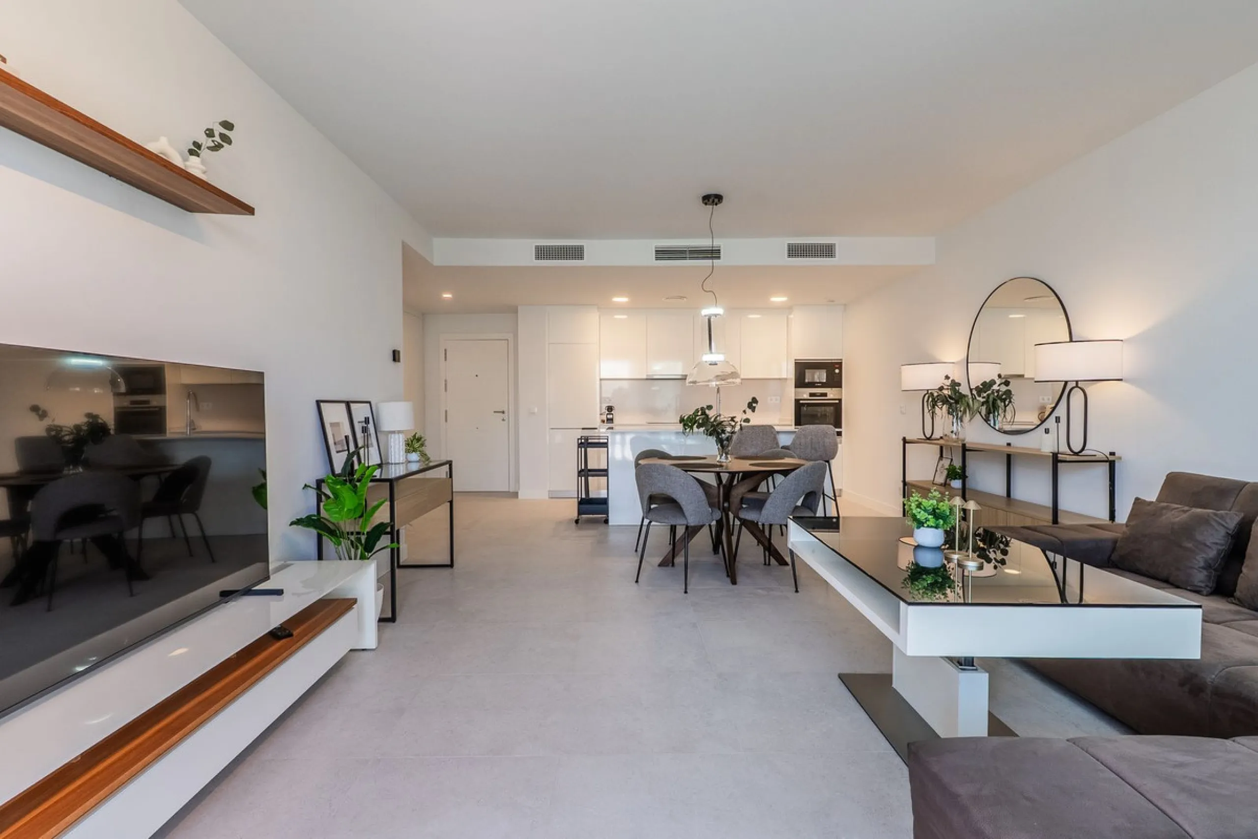 This stylish 93m² apartment with an 11m² terrace offers an ideal mix of contemporary comfort and an exceptional location. Only a 10-minute walk from the lively Estepona Port marina, the property features an airy open-plan design with a high-end kitchen, t