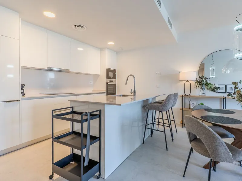 This stylish 93m² apartment with an 11m² terrace offers an ideal mix of contemporary comfort and an exceptional location. Only a 10-minute walk from the lively Estepona Port marina, the property features an airy open-plan design with a high-end kitchen, t