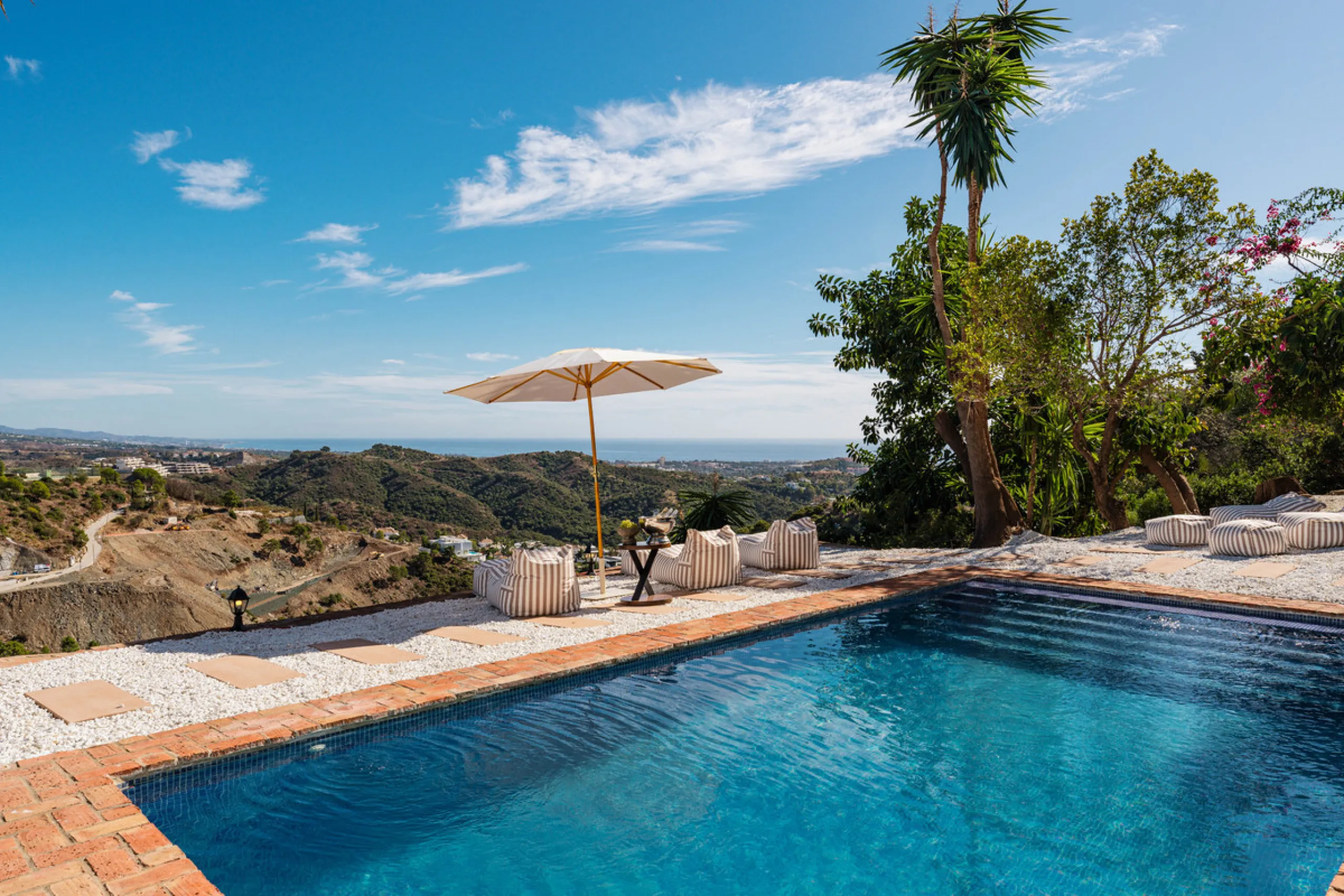 Villa in El Madroñal for sale, offering refined living within the exclusive gated community of El Madroñal 2 in Benahavís, Málaga. This six-bedroom villa with five ensuite bathrooms combines traditional Andalusian features with contemporary design. Built 