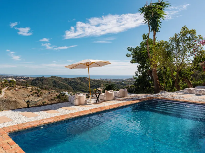 Villa in El Madroñal for sale, offering refined living within the exclusive gated community of El Madroñal 2 in Benahavís, Málaga. This six-bedroom villa with five ensuite bathrooms combines traditional Andalusian features with contemporary design. Built 