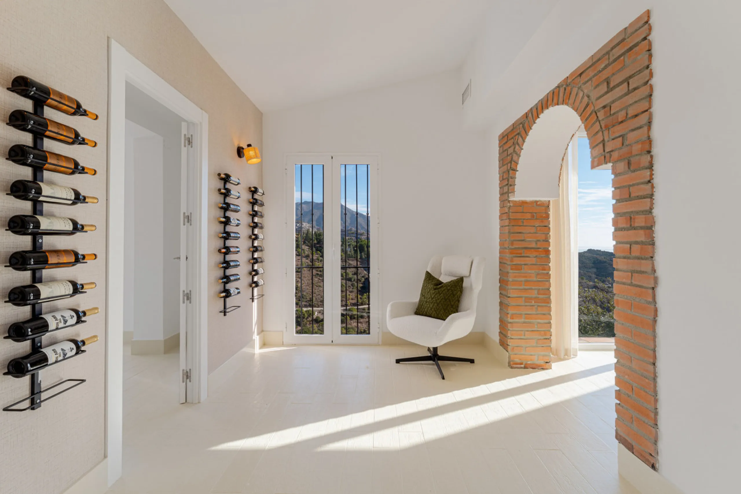 Villa in El Madroñal for sale, offering refined living within the exclusive gated community of El Madroñal 2 in Benahavís, Málaga. This six-bedroom villa with five ensuite bathrooms combines traditional Andalusian features with contemporary design. Built 