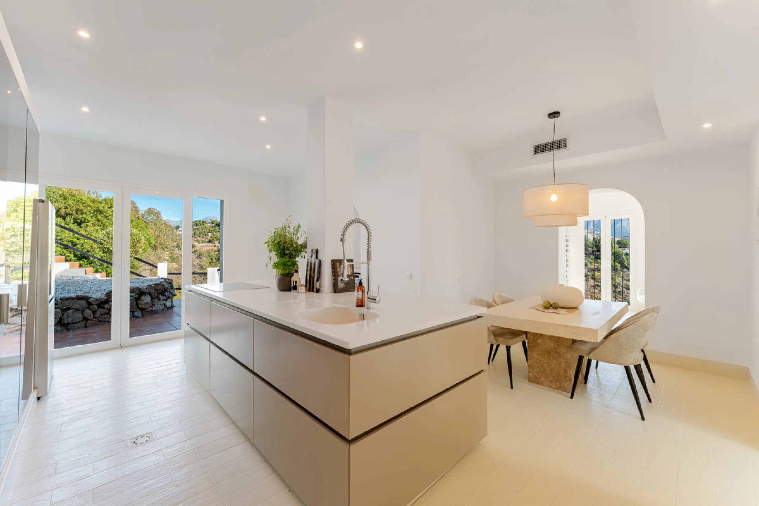 Villa in El Madroñal for sale, offering refined living within the exclusive gated community of El Madroñal 2 in Benahavís, Málaga. This six-bedroom villa with five ensuite bathrooms combines traditional Andalusian features with contemporary design. Built 