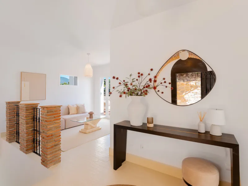 Villa in El Madroñal for sale, offering refined living within the exclusive gated community of El Madroñal 2 in Benahavís, Málaga. This six-bedroom villa with five ensuite bathrooms combines traditional Andalusian features with contemporary design. Built 