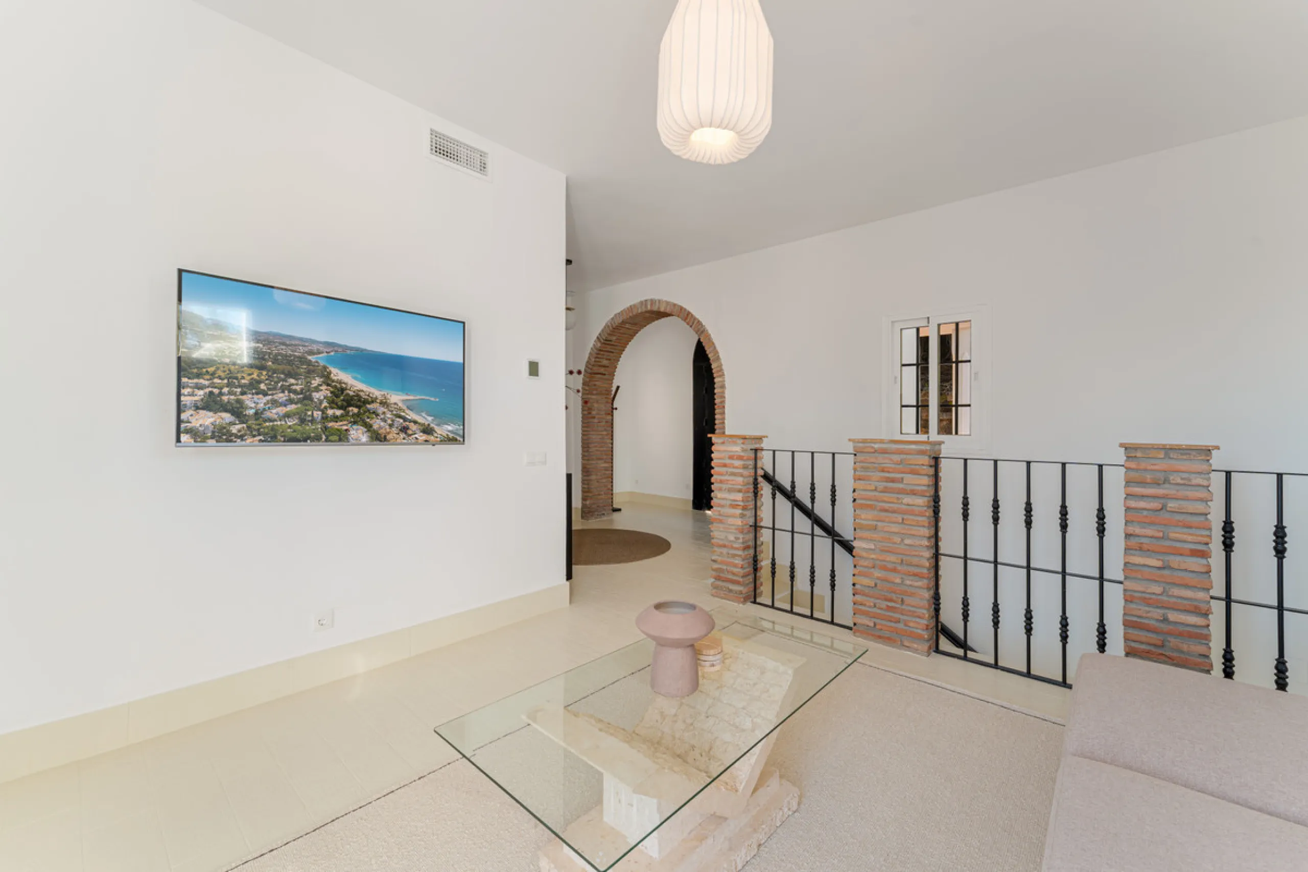 Villa in El Madroñal for sale, offering refined living within the exclusive gated community of El Madroñal 2 in Benahavís, Málaga. This six-bedroom villa with five ensuite bathrooms combines traditional Andalusian features with contemporary design. Built 