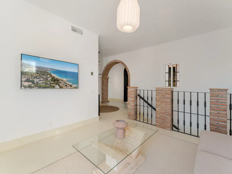 Villa in El Madroñal for sale, offering refined living within the exclusive gated community of El Madroñal 2 in Benahavís, Málaga. This six-bedroom villa with five ensuite bathrooms combines traditional Andalusian features with contemporary design. Built 