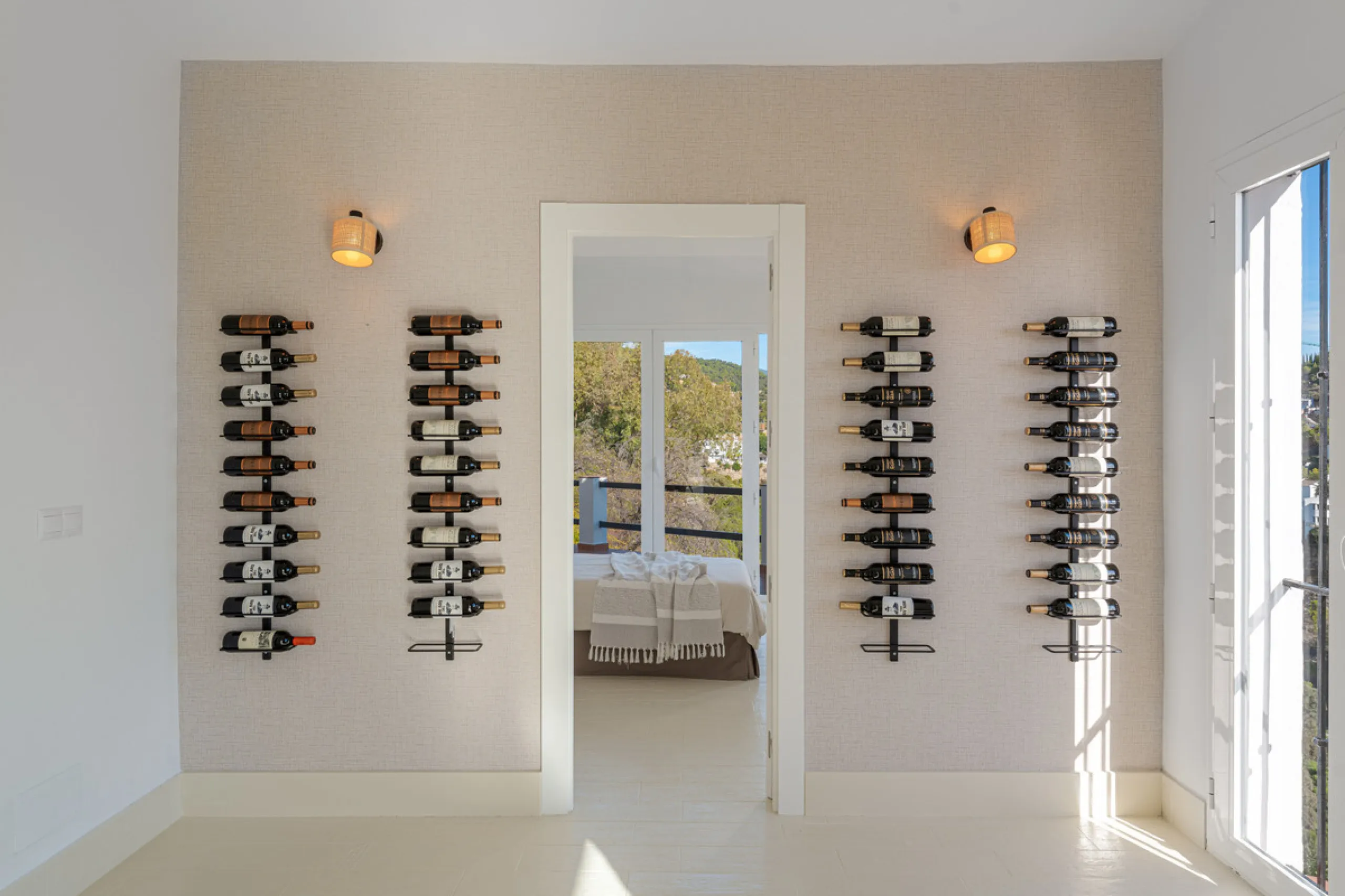 Villa in El Madroñal for sale, offering refined living within the exclusive gated community of El Madroñal 2 in Benahavís, Málaga. This six-bedroom villa with five ensuite bathrooms combines traditional Andalusian features with contemporary design. Built 