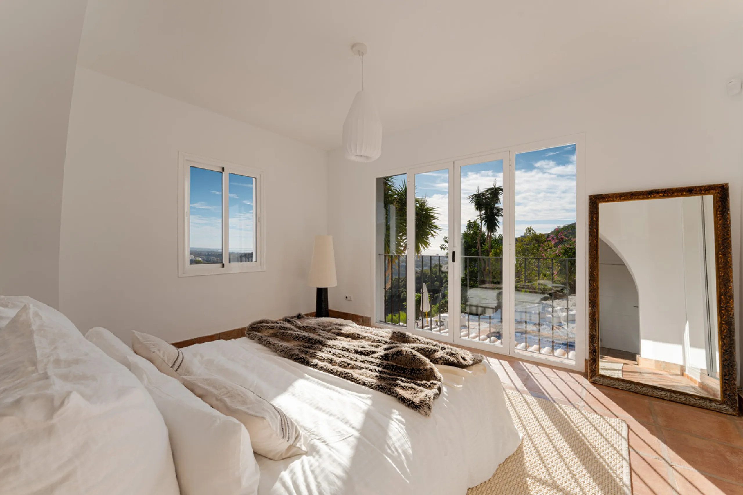 Villa in El Madroñal for sale, offering refined living within the exclusive gated community of El Madroñal 2 in Benahavís, Málaga. This six-bedroom villa with five ensuite bathrooms combines traditional Andalusian features with contemporary design. Built 