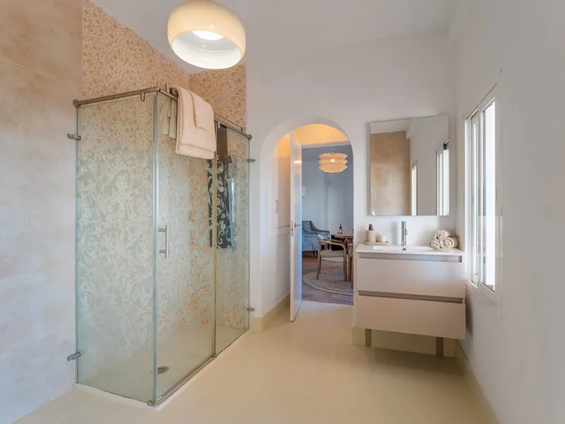 Villa in El Madroñal for sale, offering refined living within the exclusive gated community of El Madroñal 2 in Benahavís, Málaga. This six-bedroom villa with five ensuite bathrooms combines traditional Andalusian features with contemporary design. Built 