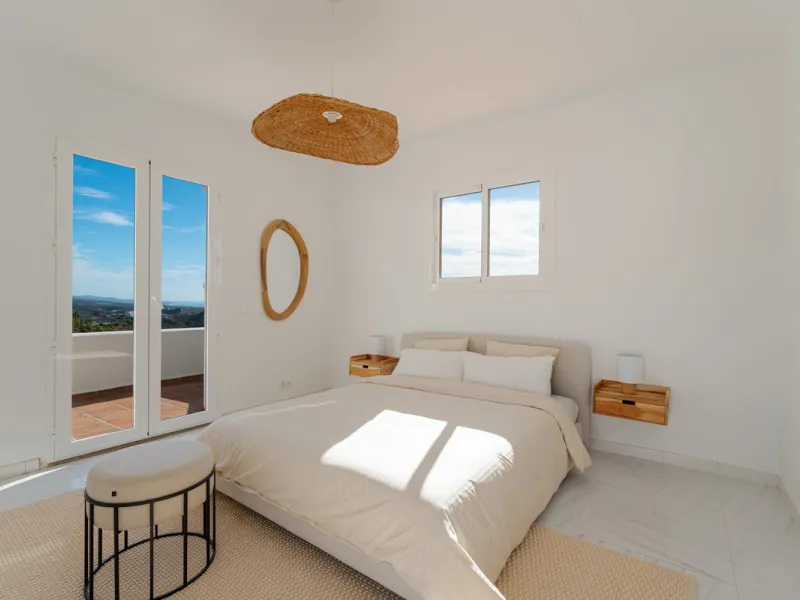 Villa in El Madroñal for sale, offering refined living within the exclusive gated community of El Madroñal 2 in Benahavís, Málaga. This six-bedroom villa with five ensuite bathrooms combines traditional Andalusian features with contemporary design. Built 