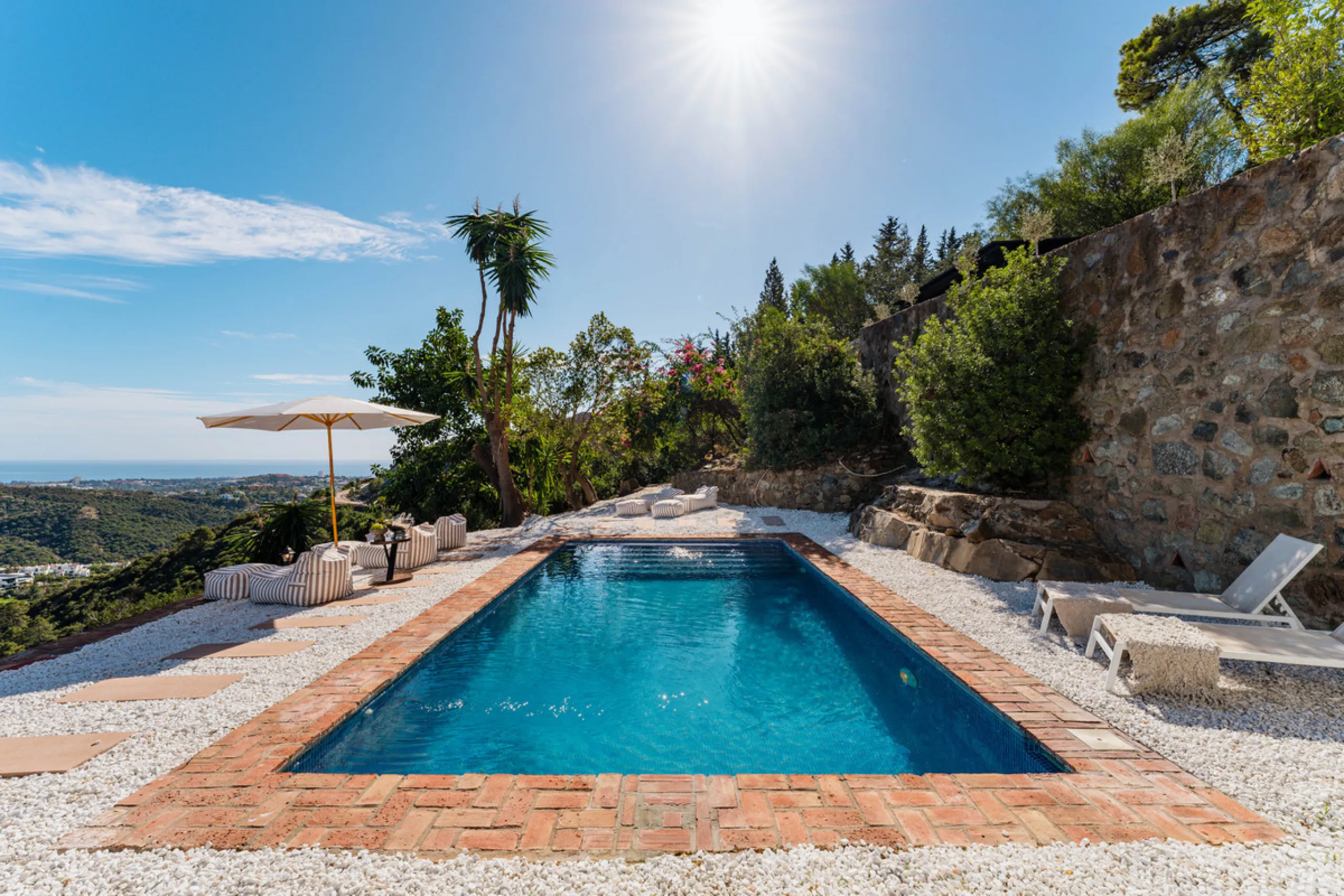 Villa in El Madroñal for sale, offering refined living within the exclusive gated community of El Madroñal 2 in Benahavís, Málaga. This six-bedroom villa with five ensuite bathrooms combines traditional Andalusian features with contemporary design. Built 