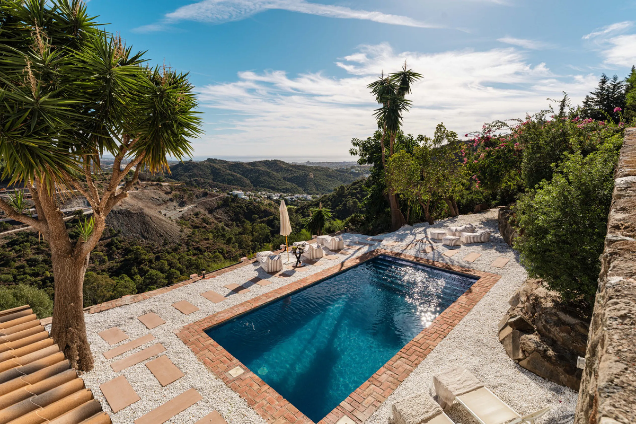 Villa in El Madroñal for sale, offering refined living within the exclusive gated community of El Madroñal 2 in Benahavís, Málaga. This six-bedroom villa with five ensuite bathrooms combines traditional Andalusian features with contemporary design. Built 