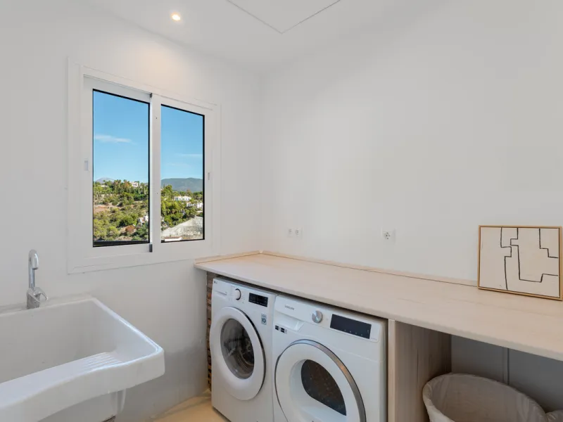 Villa in El Madroñal for sale, offering refined living within the exclusive gated community of El Madroñal 2 in Benahavís, Málaga. This six-bedroom villa with five ensuite bathrooms combines traditional Andalusian features with contemporary design. Built 