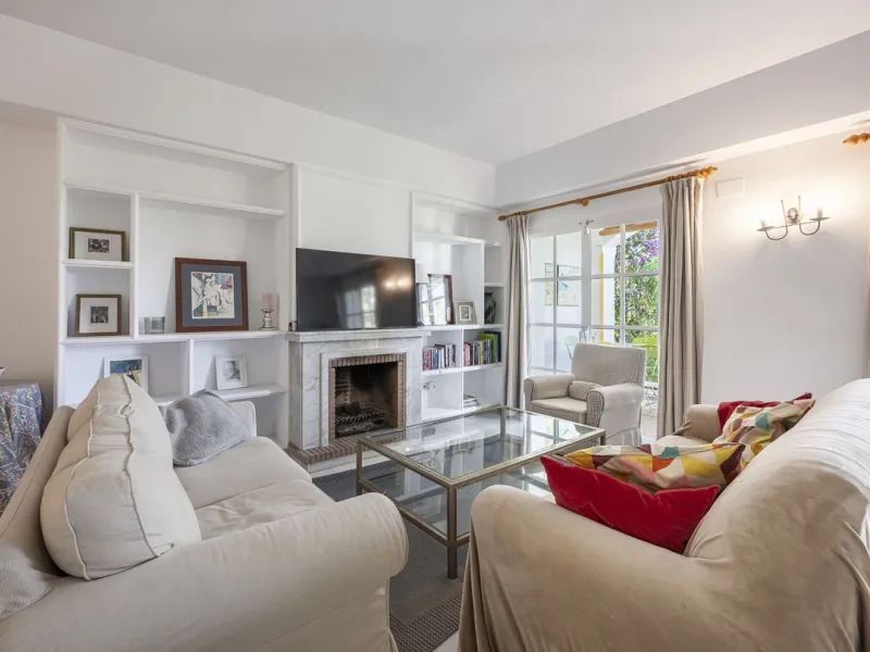 This stunning semi-detached villa is located in a traditional Andalusian development on the New Golden Mile. It is ideally located a short drive from Puerto Banús, with the beach just a short walk away.