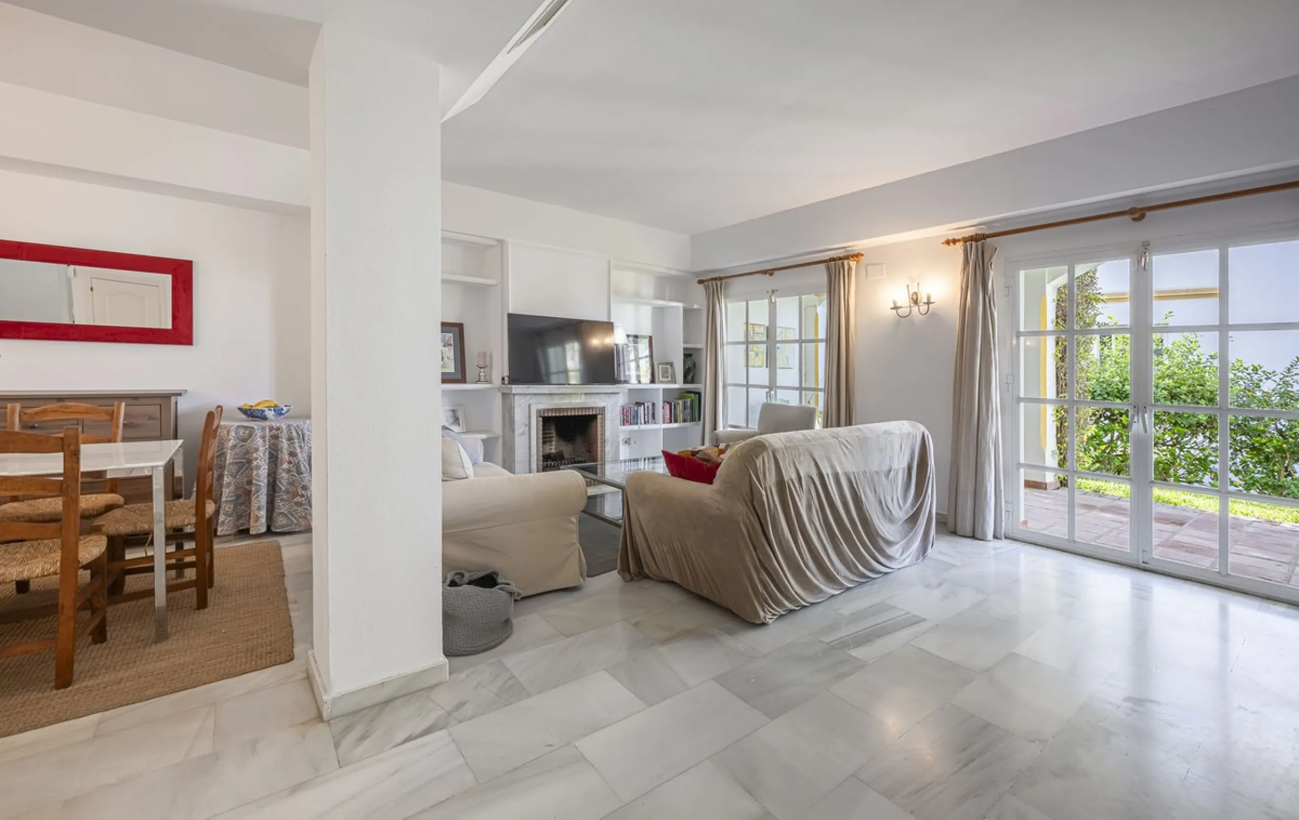 This stunning semi-detached villa is located in a traditional Andalusian development on the New Golden Mile. It is ideally located a short drive from Puerto Banús, with the beach just a short walk away.